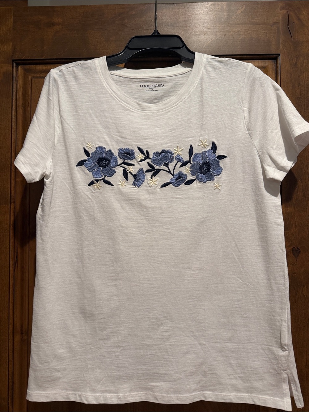 Basic white T with blue floral embroidery.